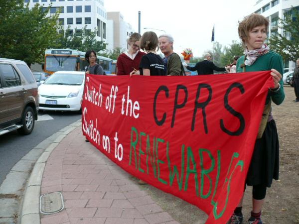 Some of the crew with "switch off the CPRS, switch on to renewables" banner